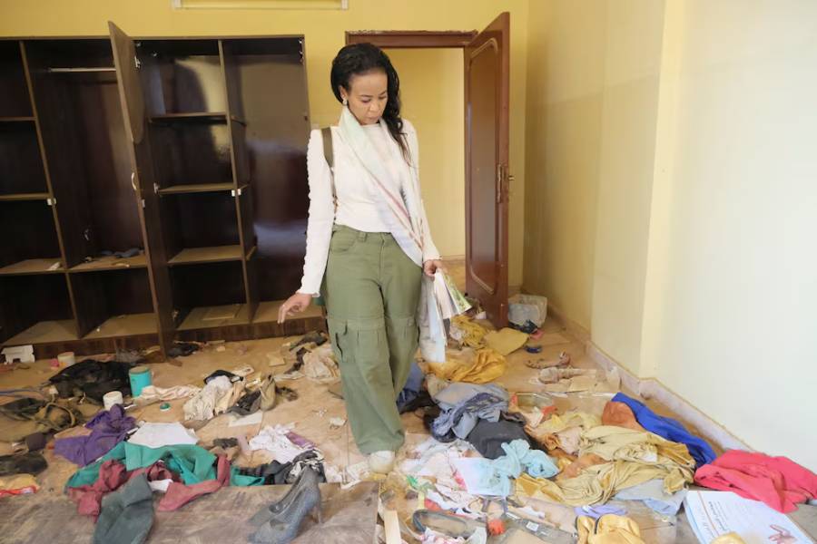Sudanese journalist, Shamael Elnoor, inspects her room at home after it was destroyed, on her return to the ruins of a once-vibrant area housing newspaper publishing offices, highlighting concerns over an industry paralysed by the ongoing war, in the capital Khartoum, Sudan, August 30, 2025.