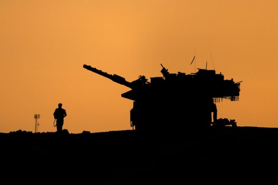 The silhouettes of a military vehicle and a soldier are seen near the Gaza border, amid the ongoing conflict in Gaza between Israel and Hamas, in Israel on December 16, 2024 — Reuters/File