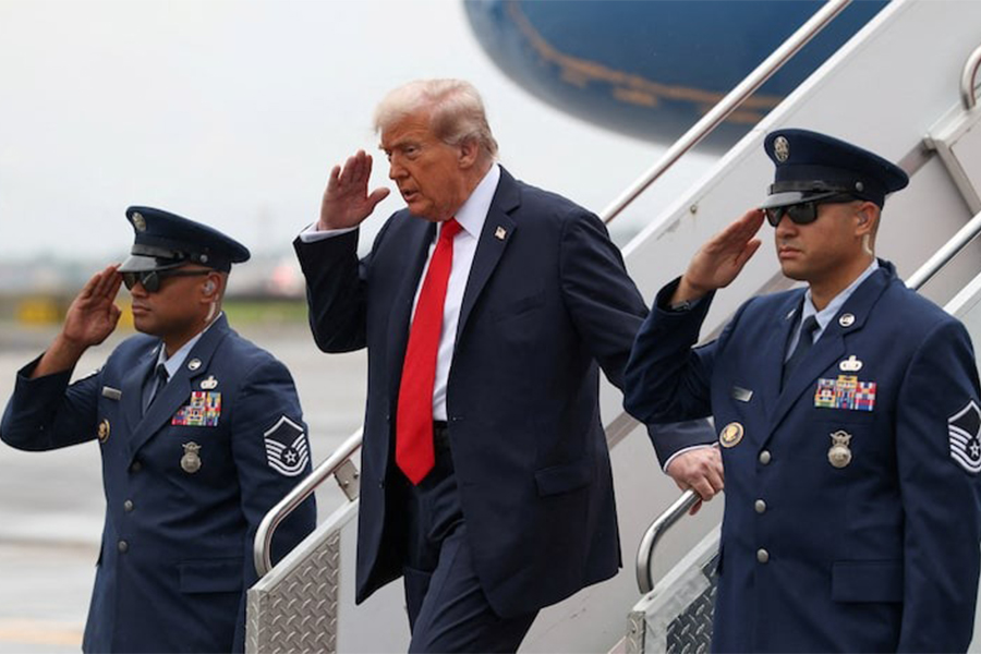 US President Donald Trump salutes as he disembarks Air Force One upon his arrival at La Guardia Airport in New York for the US Open men's tennis final, US on September 7, 2025 — Reuters photo
