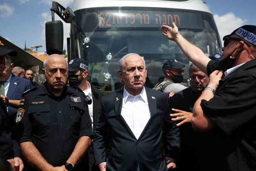 Israel's Prime Minister Benjamin Netanyahu visits the scene where a suspected shooting attack took place at the outskirts of Jerusalem Sept 8, 2025.