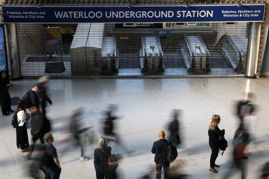Travellers pause and walk past a closed London Underground entrance during the morning rush hour, as London Tube rail strikes continue, at Waterloo Station in London, Britain, September 8, 2025.