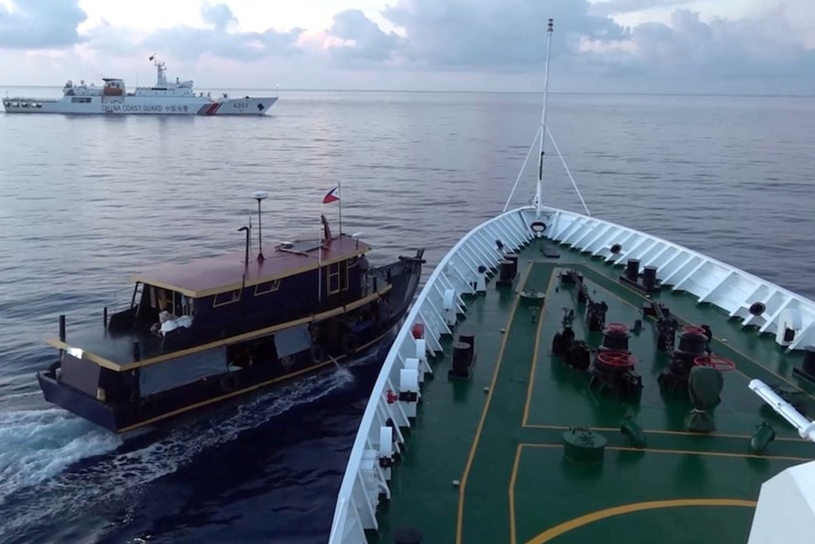 A Philippine flagged boat is blocked by a China Coast Guard vessel during an incident that resulted in a collision between the two vessels, in the disputed waters of the South China Sea in this screen grab obtained from handout video released on October 22, 2023 — China Coast Guard/Handout via REUTERS/File