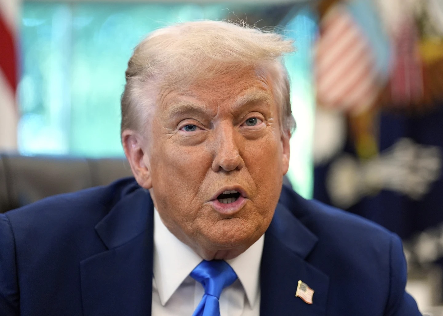 President Donald Trump speaks in the Oval Office of the White House, Friday, Sept. 19, 2025, in Washington. (AP Photo/Alex Brandon)