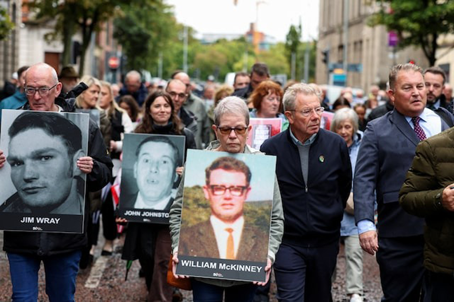 Families of the victims of the 1972 'Bloody Sunday' killings walk to the high court on the first day of the trial of the British army veteran known as 'Soldier F' charged with two murders and five attempted murders in relation to Bloody Sunday, in Belfast, Northern Ireland, September 15, 2025.
