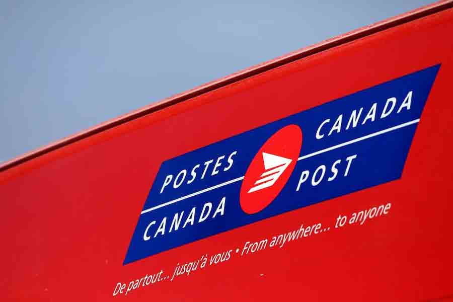 A Canada Post logo is seen as striking workers picket outside a mail processing plant in Ottawa, Ontario, Canada, November 23, 2018.