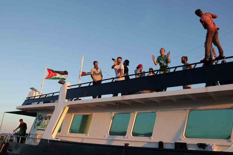 Greta Thunberg and members of the crew react aboard a ship, part of the Global Sumud Flotilla aiming to reach Gaza and break Israel's naval blockade, as they sail off Crete island, Greece, Sept 25, 2025.