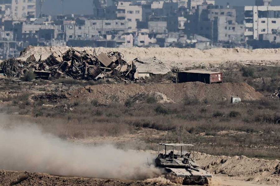 An Israeli tank manoeuvres in Gaza, as seen from the Israeli side of the border, Sept 28, 2025.