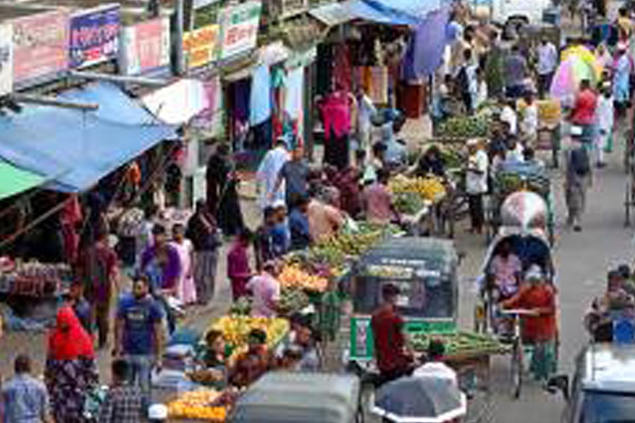 Vendors occupy major parts of the city roads in various busy areas, creating problem for vehicle, passerby. The photo was taken from Bandarbazar area in Sylhet city on Sunday -FE Photo