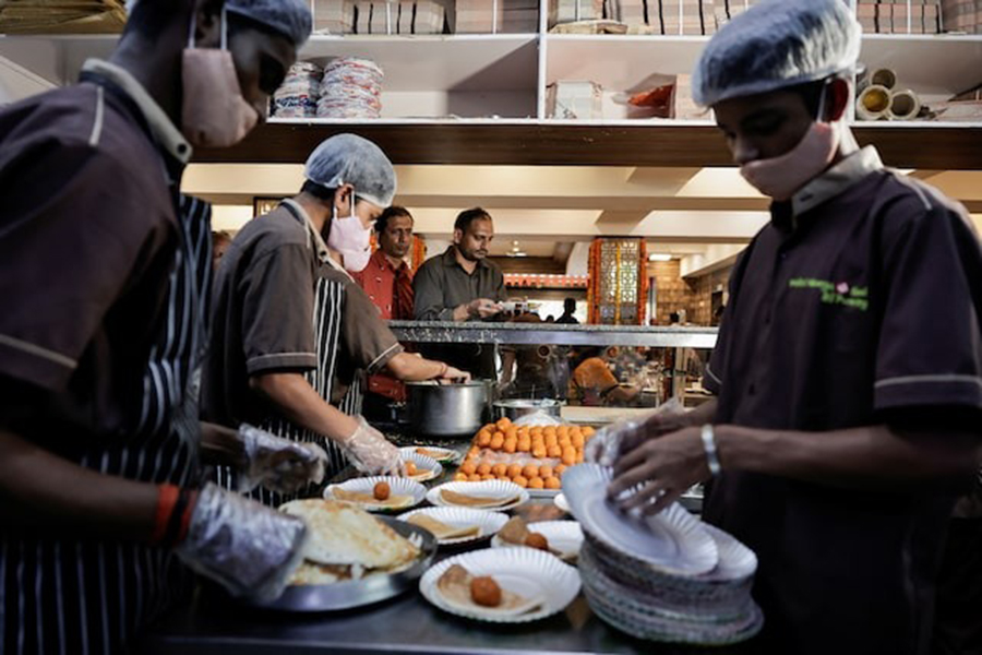 Staff serve food at a restaurant, which is serving dosas free of cost to people who cast their votes, during the second phase of the general elections, in Bengaluru, in Karnataka, India on April 26, 2024 — Reuters/File