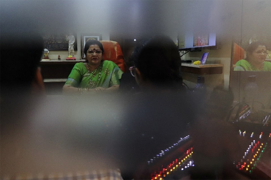 Vanaja Rao, owner of a matchmaking agency, discusses marriage prospects with clients in her office, in Hyderabad, India on October 1, 2025 — Reuters photo