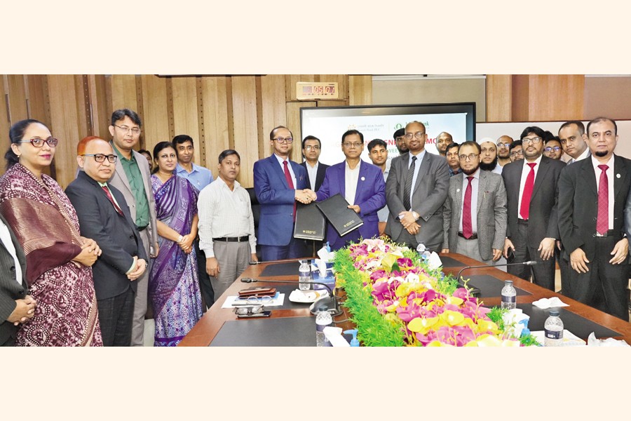 Sonali Bank CEO & Managing Director Md Afzal Karim and Islami Bank Bangladesh Limited Managing Director & CEO Mohammed Monirul Moula exchanging documents of a deal at the Sonali Bank head office in the city on Wednesday.