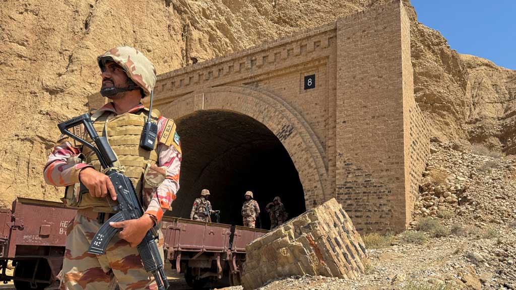 Pakistan army soldiers stand at a tunnel where the Jaffar Express train was attacked by separatist militants, in Bolan, Balochistan, Pakistan, Mar 15, 2025. REUTERS