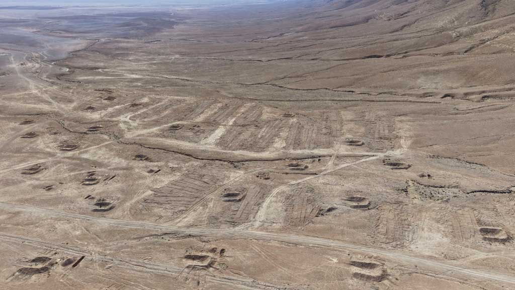A drone view of the mass grave site in the desert near the eastern Syrian town of Dhumair, Feb 27, 2025. A Reuters investigation found that the Assad government secretly trucked thousands of bodies there from an exposed mass grave in the Damascus suburb of Qutayfah from 2019-2021. REUTERS