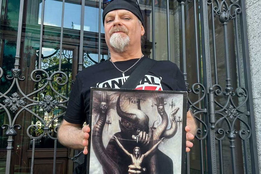 Celtic Frost frontman Tom Fischer holds a copy of the Swiss heavy metal band's 1985 album "To Mega Therion", in Zurich, Switzerland, Jul 5, 2025.