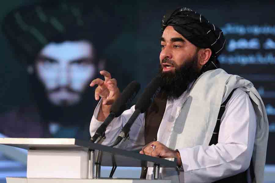 Afghan Taliban's Deputy Minister of Information and Culture and spokesman Zabihullah Mujahid speaks during the death anniversary of Mullah Mohammad Omar, the late leader and founder of the Taliban, in Kabul, Afghanistan, April 24, 2022.