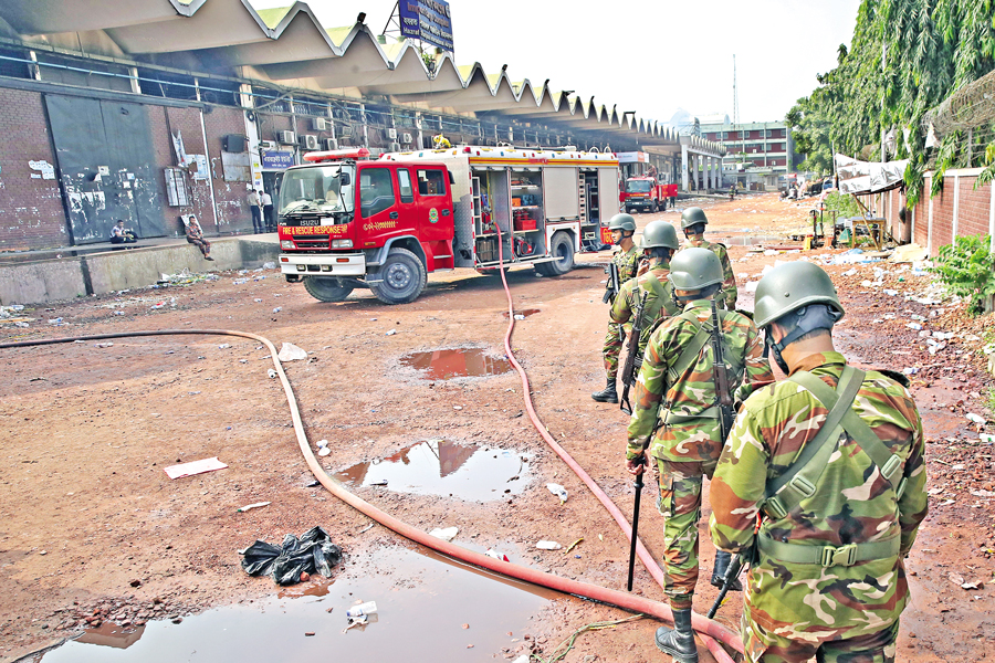 Members of the Bangladesh Army along with firefighters were engaged even on Sunday morning in extinguishing the fire which broke out at the cargo section of Hazrat Shahjalal International Airport in Dhaka on Saturday. — FE Photo