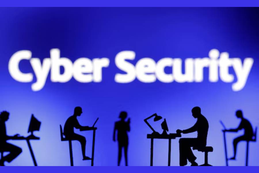 Figurines with computers and smartphones are seen in front of the words "Cyber Security" in this illustration taken, February 19, 2024.
