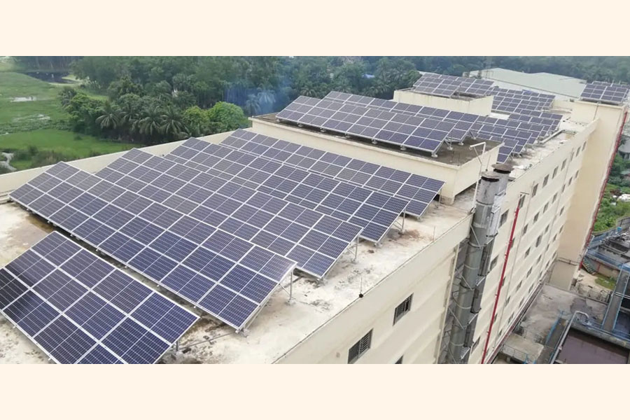 Solar panels at a rooftop in Dhaka —www.solshare.com Photo