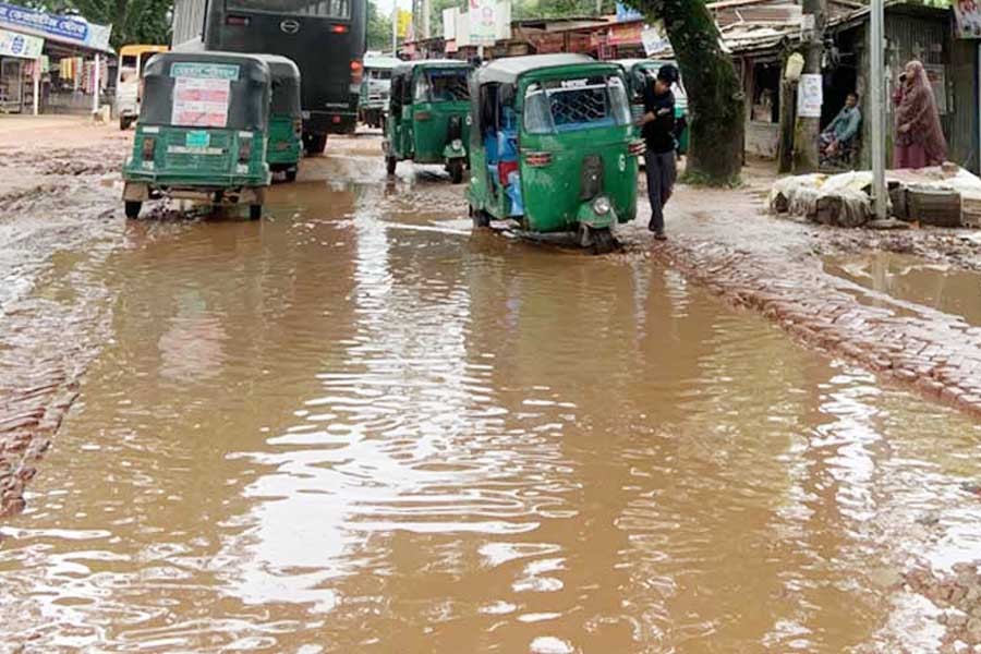 Photo shows small and large ditches on most of the stretch of a road at Mendibag in Sylhet - FE Photo