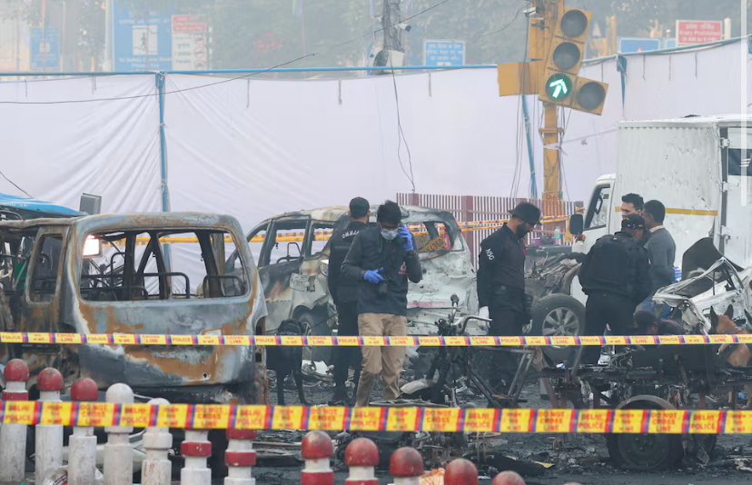 Security personnel work at the site of an explosion near the historic Red Fort in the old quarters of Delhi, India, November 11, 2025. REUTERS/Adnan Abidi