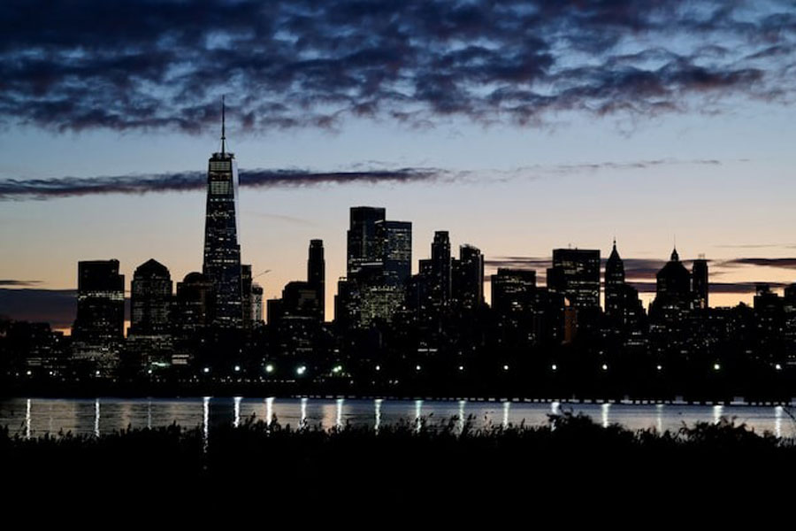 The skyline of Lower Manhattan is seen at dawn from across the Hudson River in New York City, U.S., October 18, 2025.