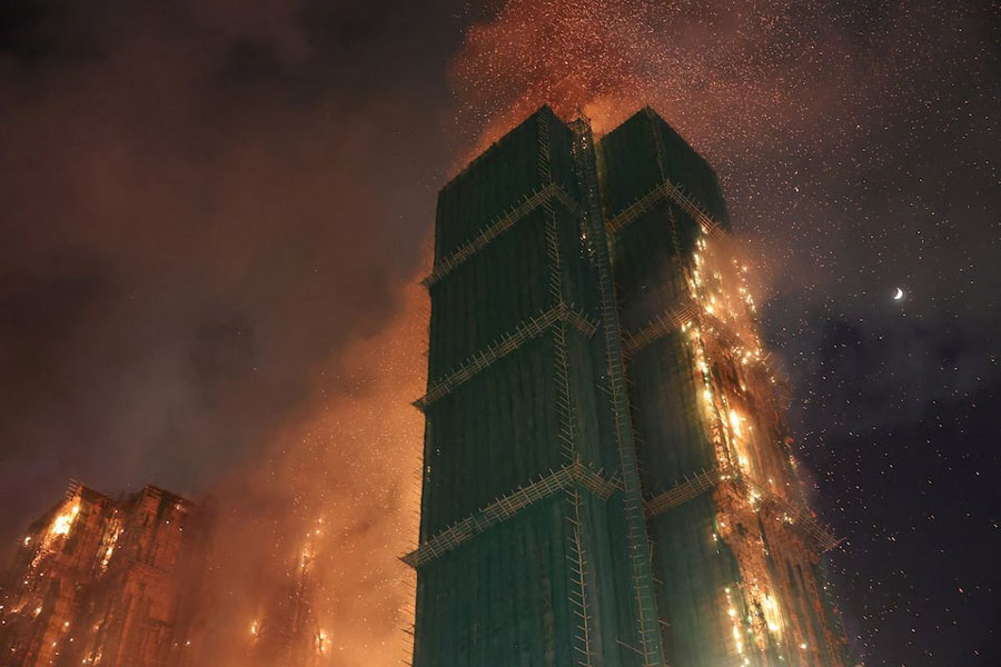 Fire burns bamboo scaffolding across multiple buildings at Wang Fuk Court housing estate, in Tai Po, Hong Kong, China, November 26, 2025.