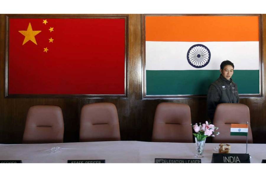 A man walks inside a conference room used for meetings between military commanders of China and India, at the Indian side of the Indo-China border at Bumla, in the northeastern Indian state of Arunachal Pradesh, Nov 11, 2009.
