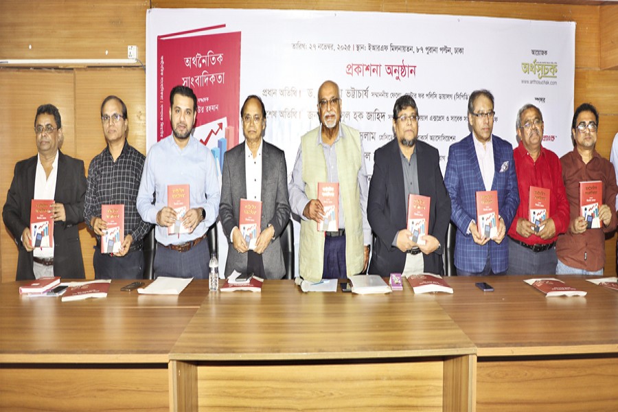 Dr Debapriya Bhattacharya, Distinguished Fellow of the Centre for Policy Dialogue (CPD), and Shamsul Huq Zahid, Editor of The Financial Express, among others, holding the copies of a book - 'Economic Journalism' - written by Ziaur Rahman, Editor of Arthosuchak, at its launching ceremony in the capital on Thursday. — FE Photo