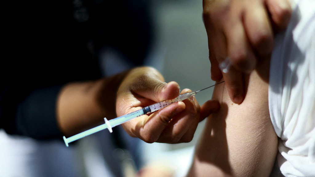 A nurse administers a dose of the measles vaccine to a man during a vaccination campaign in response to a measles outbreak, at the Estadio Olimpico Universitario in Mexico City, Mexico, Nov 12, 2025. REUTERS