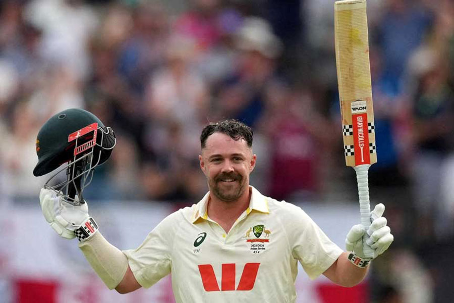 The Ashes - Australia v England - First Test - Perth Stadium, Perth, Australia - Nov 22, 2025 Australia's Travis Head celebrates after reaching his century REUTERS/Asanka Brendon Ratnayake