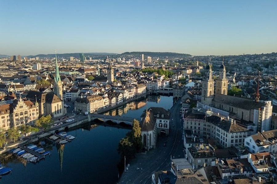 A drone view shows the Limmat river, the Grossmunster Church and the Fraumunster Church on an early morning in Zurich, Switzerland May 2, 2025.