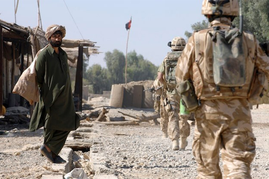 British Army soldiers patrol through a market street in southern Helmand province, Afghanistan on November 7, 2007 — Reuters/File