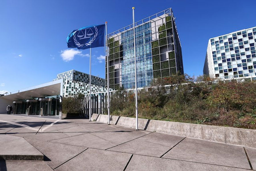 People stand outside the International Criminal Court (ICC) as the United States is considering imposing sanctions as soon as this week against the entire International Criminal Court, in The Hague, Netherlands, September 22, 2025.