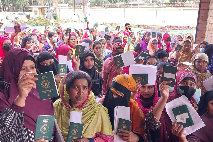 A group of Bangladeshi migrant women displaying their passports — MJF Photo