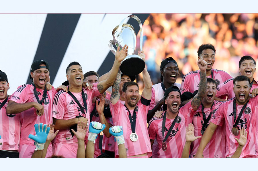 Fort Lauderdale, Florida, USA; Inter Miami forward Lionel Messi (10) lifts the Philip F Anschutz trophy after winning the 2025 MLS Cup against the Vancouver Whitecaps FC at Chase Stadium. Reuters