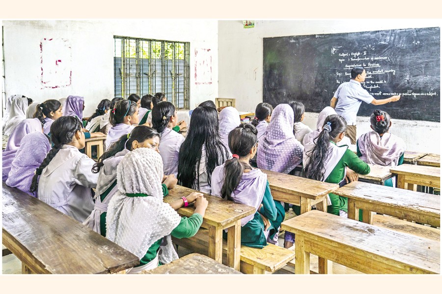 A teacher teaches in a class room.