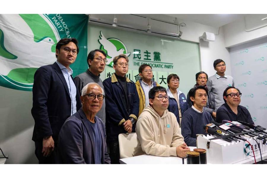Lo Kin-hei, chairman of Hong Kong’s Democratic Party, and other party members attend a press conference following an extraordinary general meeting to vote on the party’s dissolution, in Hong Kong, China Dec 14, 2025.