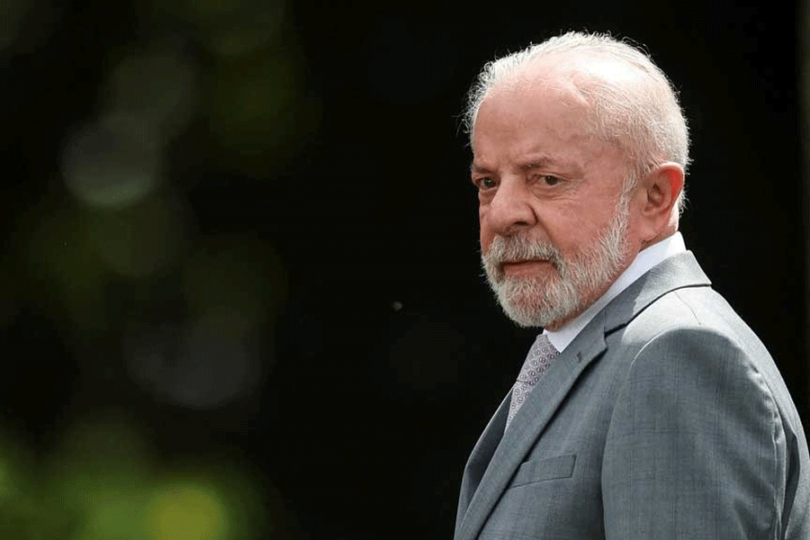 Brazil's President Luiz Inacio Lula da Silva looks on before posing for a family photo with ministers during a ministerial meeting at Granja do Torto official residence, in Brasilia, Brazil, Dec 17, 2025.