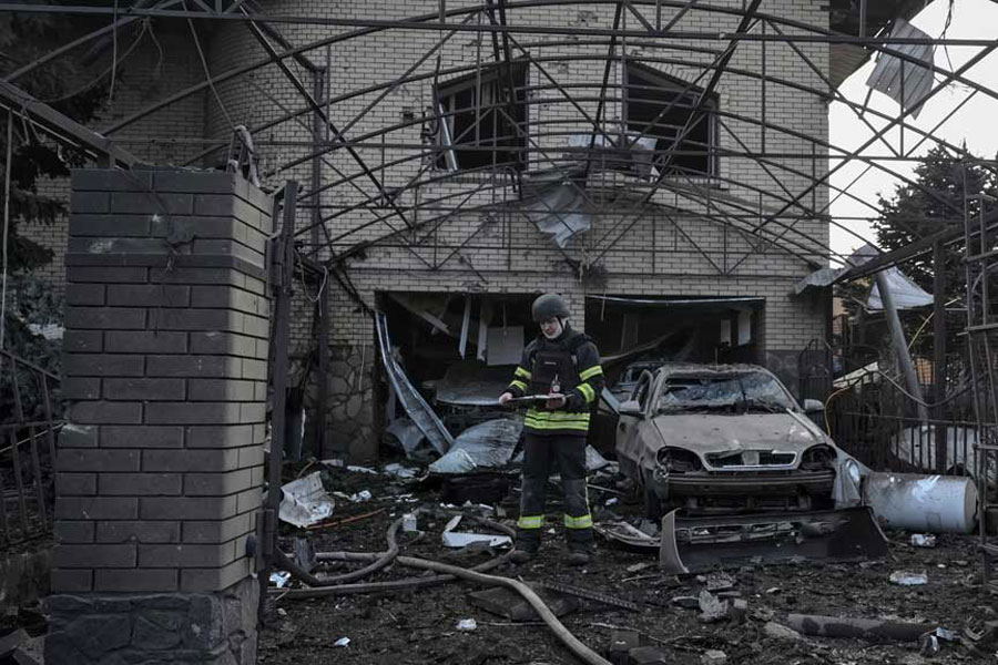 A rescuer works at the site of a Russian air strike, amid Russia's attack on Ukraine, in Zaporizhzhia, Ukraine Dec 19, 2025.