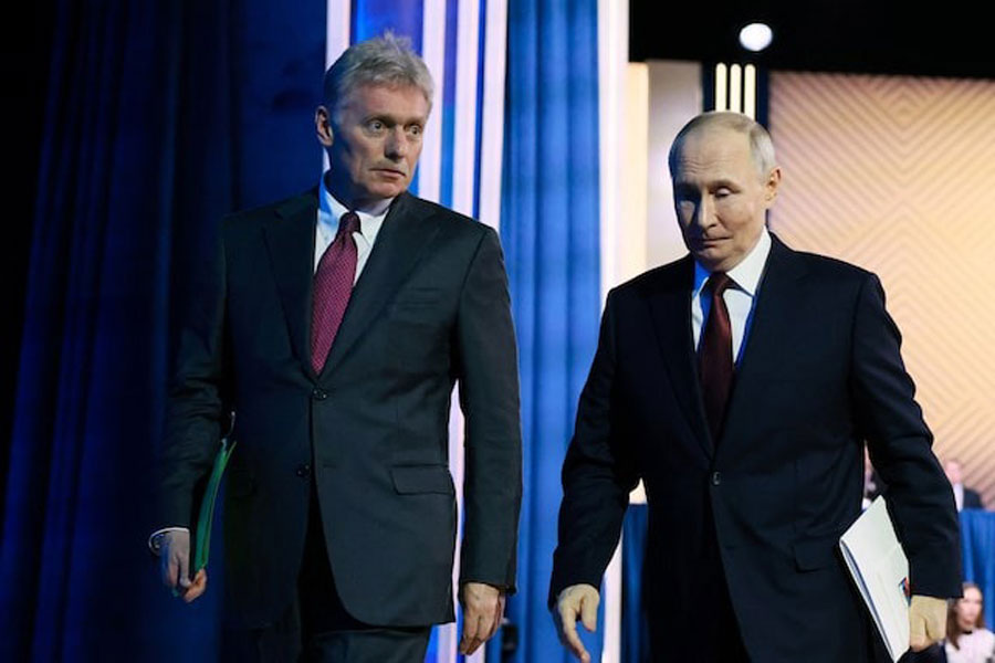 Russian President Vladimir Putin and Kremlin spokesman Dmitry Peskov leave after Putin's annual press conference and phone-in in Moscow, Russia December 19, 2025.