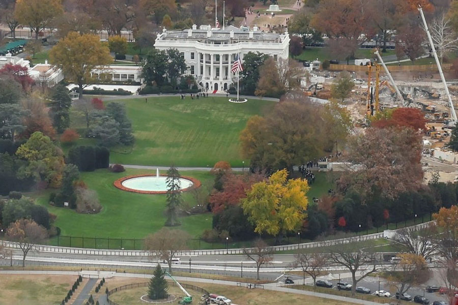 Tourists observe demolition of the East Wing of the White House during construction of US President Donald Trump’s proposed ballroom from the top of the reopened Washington Monument, following the longest shutdown of the US government in Washington, DC, US, November 15, 2025.