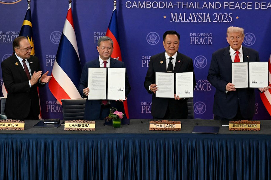 Malaysia's Prime Minister Anwar Ibrahim applauds as Cambodia's Prime Minister Hun Manet, Thailand's Prime Minister Anutin Charnvirakul and U.S. President Donald Trump hold up documents during the ceremonial signing of a ceasefire agreement between Thailand and Cambodia on the sidelines of the 47th Association of Southeast Asian Nations (ASEAN) Summit in Kuala Lumpur, Malaysia on October 26, 2025 — Pool via Reuters/File