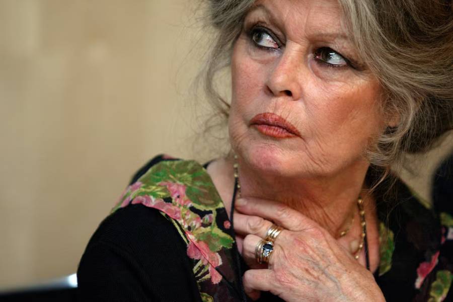 French movie star Brigitte Bardot listens during a news conference in Paris, May 6, 2003. The news conference was organised to promote the fight of the Brigitte Bardot foundation against the conditions of transportation of the animals bred for the meat market.