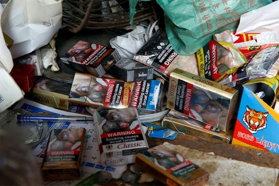 Cigarette packets with graphic pictorial warnings are pictured on the counter of a cigarette seller in Mumbai, India on January 8,0 2018 — Reuters/File