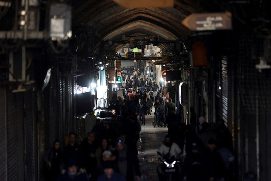 People walk past closed shops, following protests over a plunge in the currency's value, in the Tehran Grand Bazaar in Tehran, Iran on December 30, 2025 — WANA (West Asia News Agency) via REUTERS