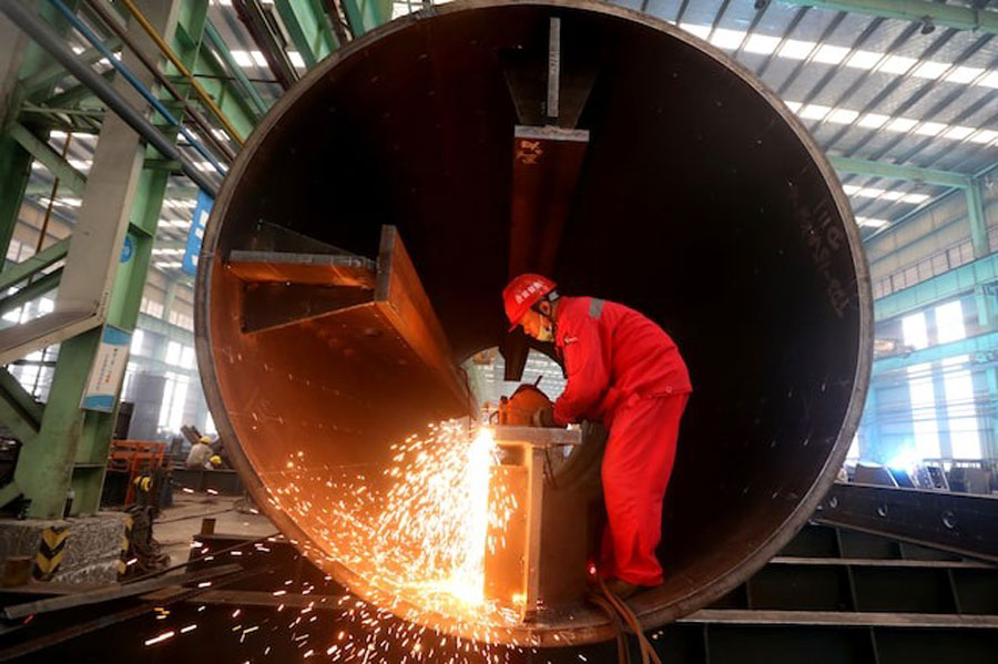 A man works at a production base of China Construction Steel Structure Corp Ltd (CSCEC Steel) in Meishan, Sichuan province, China September 3, 2019.