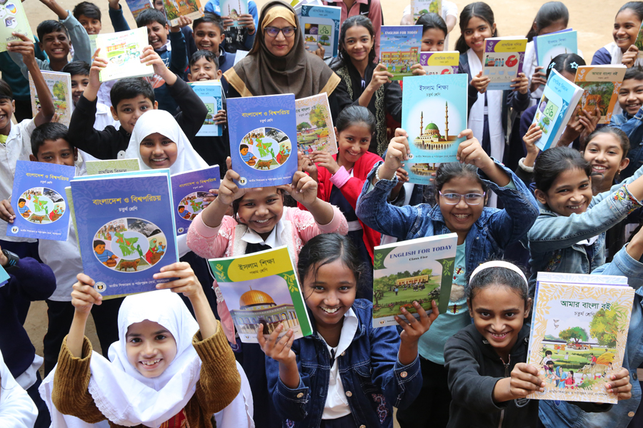 Joyous students with new textbooks in their hands on the first day of New Year in Dhaka —FE Photo