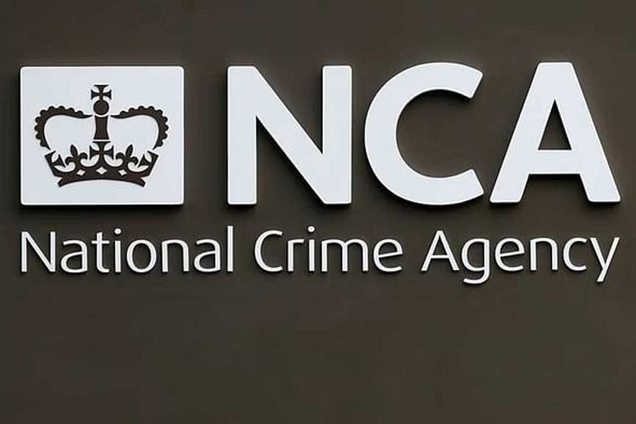 A sign is seen outside the National Crime Agency (NCA) headquarters in London Oct 7, 2013. The new body has been launched to pursue organised criminals.