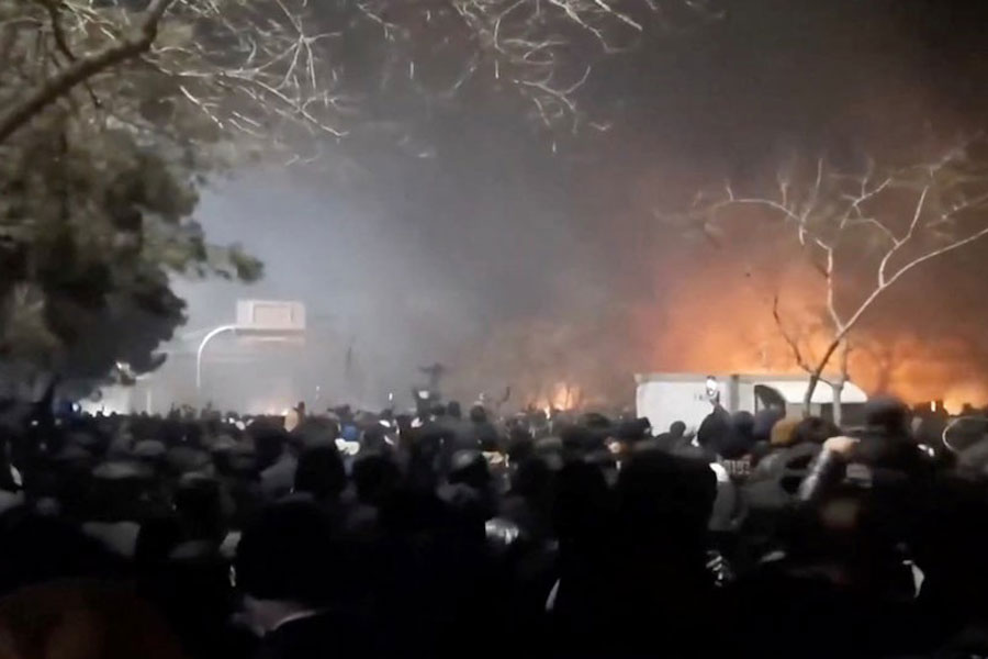 Smoke rises as protesters gather amid evolving anti-government unrest at Vakilabad highway in Mashhad, Razavi Khorasan province, Iran, released on January 10, 2026, in this screen grab obtained from a social media video.