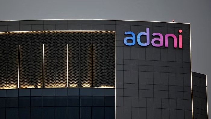 The logo of the Adani Group is seen on the facade of one of its buildings on the outskirts of Ahmedabad, India, April 13, 2021. REUTERS